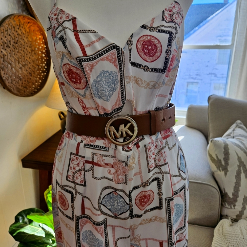 A never worn Guess jumpsuit size S, multi-color.